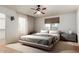 Stylish bedroom featuring neutral tones, large windows, and modern decor for a peaceful retreat at 548 N 82Nd St, Mesa, AZ 85207