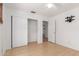 Bedroom with bamboo floors and a closet with sliding doors, in a naturally lit space at 548 N 82Nd St, Mesa, AZ 85207