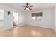 Bright bedroom featuring bamboo floors, an ensuite bathroom, and a ceiling fan at 548 N 82Nd St, Mesa, AZ 85207