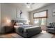 Staged bedroom features a large window, neutral colors, and a modern minimalist aesthetic at 548 N 82Nd St, Mesa, AZ 85207