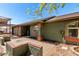 Charming home exterior with brick accents, desert landscaping, and a covered carport for convenience at 548 N 82Nd St, Mesa, AZ 85207