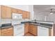 Kitchen features a stainless steel sink and appliances, a breakfast bar, and plenty of cabinets at 548 N 82Nd St, Mesa, AZ 85207