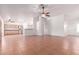 Open-concept living area with tile floors, ceiling fan, and seamless flow to the kitchen at 548 N 82Nd St, Mesa, AZ 85207