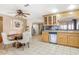 Kitchen with light wood cabinets, stainless steel appliances, and tile flooring at 6130 W Monte Vista Rd, Phoenix, AZ 85035