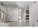 Bright entryway with tile floors, staircase, and coat closet at 6249 N 78Th St # 58, Scottsdale, AZ 85250