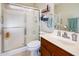Bathroom with updated vanity, toilet, and shower with glass enclosure at 6877 S Oakmont Dr, Chandler, AZ 85249
