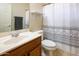 Clean bathroom with updated vanity, shower/tub combo and decorative shower curtain at 6877 S Oakmont Dr, Chandler, AZ 85249