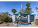 Attractive Sun Bird Golf Resort community entrance sign with an American flag waving above it and colorful flowerbeds around its base at 6877 S Oakmont Dr, Chandler, AZ 85249