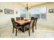 Dining area with wood table and six chairs, near kitchen at 6877 S Oakmont Dr, Chandler, AZ 85249