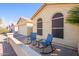 View of the front of the house with two rocking chairs on the patio at 6877 S Oakmont Dr, Chandler, AZ 85249