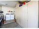 Garage with washer and dryer, additional storage cabinets and flooring at 6877 S Oakmont Dr, Chandler, AZ 85249