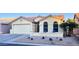 House exterior with a beige facade and garage at 6877 S Oakmont Dr, Chandler, AZ 85249