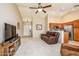 Living room with leather furniture, and views of kitchen and entry at 6877 S Oakmont Dr, Chandler, AZ 85249