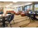 Lounge area featuring comfortable leather seating, tables, and a view of the community outside at 6877 S Oakmont Dr, Chandler, AZ 85249