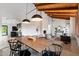 Open concept dining room with a view into the living room and kitchen at 6936 E Friess Dr, Scottsdale, AZ 85254