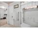 Bathroom features a tub shower combo and built-in shelving at 6962 W Glenn Dr, Glendale, AZ 85303