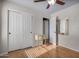 Bedroom with wood floors, double door closet and small table at 6962 W Glenn Dr, Glendale, AZ 85303