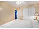 Bedroom with double bed, ceiling fan, and sliding door closet at 6962 W Glenn Dr, Glendale, AZ 85303