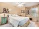 Bedroom with double bed, nightstand, and decorative wall art at 6962 W Glenn Dr, Glendale, AZ 85303