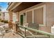Front porch with a bench and stone pillars at 6962 W Glenn Dr, Glendale, AZ 85303