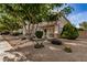 Landscaped front yard with desert plants and gravel at 6962 W Glenn Dr, Glendale, AZ 85303