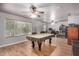 Game room with pool table, ceiling fans and home office area at 6962 W Glenn Dr, Glendale, AZ 85303