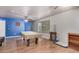Game room with pool table, neutral wall colors, and wood flooring at 6962 W Glenn Dr, Glendale, AZ 85303