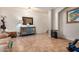 Living room with tiled floors, a cabinet, and a coat rack at 6962 W Glenn Dr, Glendale, AZ 85303
