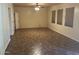 Large living room with tile floors and neutral-colored walls at 6962 W Glenn Dr, Glendale, AZ 85303