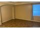 Empty living room with tiled floors and neutral walls at 6962 W Glenn Dr, Glendale, AZ 85303