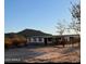 Mobile home with a covered porch and desert landscape at 735 S Ruby Rd, Maricopa, AZ 85139