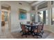 Elegant dining room with a round table and comfortable chairs at 7469 E Red Bird Rd, Scottsdale, AZ 85266