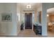 Bright entryway with hardwood floors, decorative console table, and view into dining area at 7469 E Red Bird Rd, Scottsdale, AZ 85266