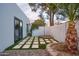Private backyard with artificial turf, gravel, and a flagstone patio at 8709 E Irish Hunter Trl, Scottsdale, AZ 85258