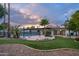 Landscaped backyard oasis with a pool and patio at 8709 E Irish Hunter Trl, Scottsdale, AZ 85258