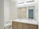 Modern bathroom with double vanity, marble countertops, and large mirror at 8709 E Irish Hunter Trl, Scottsdale, AZ 85258