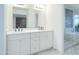Bathroom with double vanity, marble shower, and modern fixtures at 8709 E Irish Hunter Trl, Scottsdale, AZ 85258