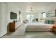 Serene bedroom with a plush bed, natural light, and a sliding glass door leading to an outdoor sitting area at 8709 E Irish Hunter Trl, Scottsdale, AZ 85258