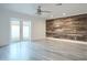 Bedroom with wood-look floors and barn wood accent wall at 8709 E Irish Hunter Trl, Scottsdale, AZ 85258