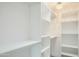 Large walk-in closet with white shelves and hanging rods at 8709 E Irish Hunter Trl, Scottsdale, AZ 85258