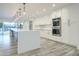 Modern kitchen with island, stainless steel appliances, and white cabinets at 8709 E Irish Hunter Trl, Scottsdale, AZ 85258