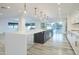 Modern kitchen with large island and white cabinets at 8709 E Irish Hunter Trl, Scottsdale, AZ 85258