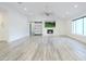 Spacious living room with a fireplace and large windows at 8709 E Irish Hunter Trl, Scottsdale, AZ 85258