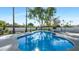Inviting kidney-shaped pool surrounded by lush landscaping at 8709 E Irish Hunter Trl, Scottsdale, AZ 85258