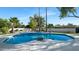Inviting kidney-shaped pool with a large surrounding patio at 8709 E Irish Hunter Trl, Scottsdale, AZ 85258