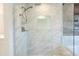 Walk-in shower with marble tile and built-in seat at 8709 E Irish Hunter Trl, Scottsdale, AZ 85258