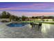 Expansive backyard with pool, spa, and patio seating at 8802 E Rimrock Dr, Scottsdale, AZ 85255