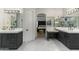 Luxurious bathroom with double vanity and marble floors at 8802 E Rimrock Dr, Scottsdale, AZ 85255