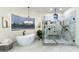 Bathroom with soaking tub and large walk-in shower at 8802 E Rimrock Dr, Scottsdale, AZ 85255