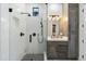 Stylish bathroom with a walk-in shower and gray vanity at 8802 E Rimrock Dr, Scottsdale, AZ 85255